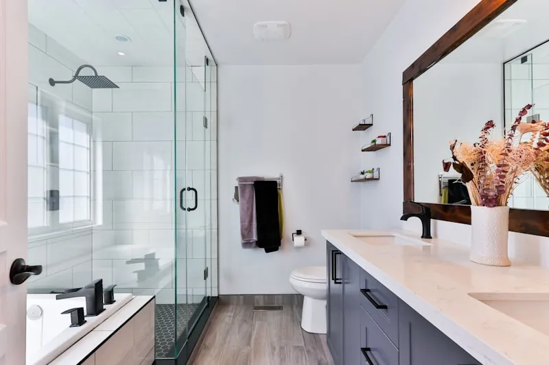 Spacious bathroom remodel featuring a large walk-in shower and modern double vanity