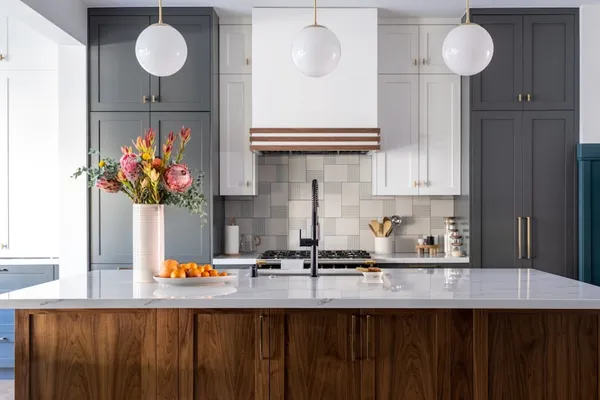Modern custom kitchen remodel with large island and stylish pendant lighting